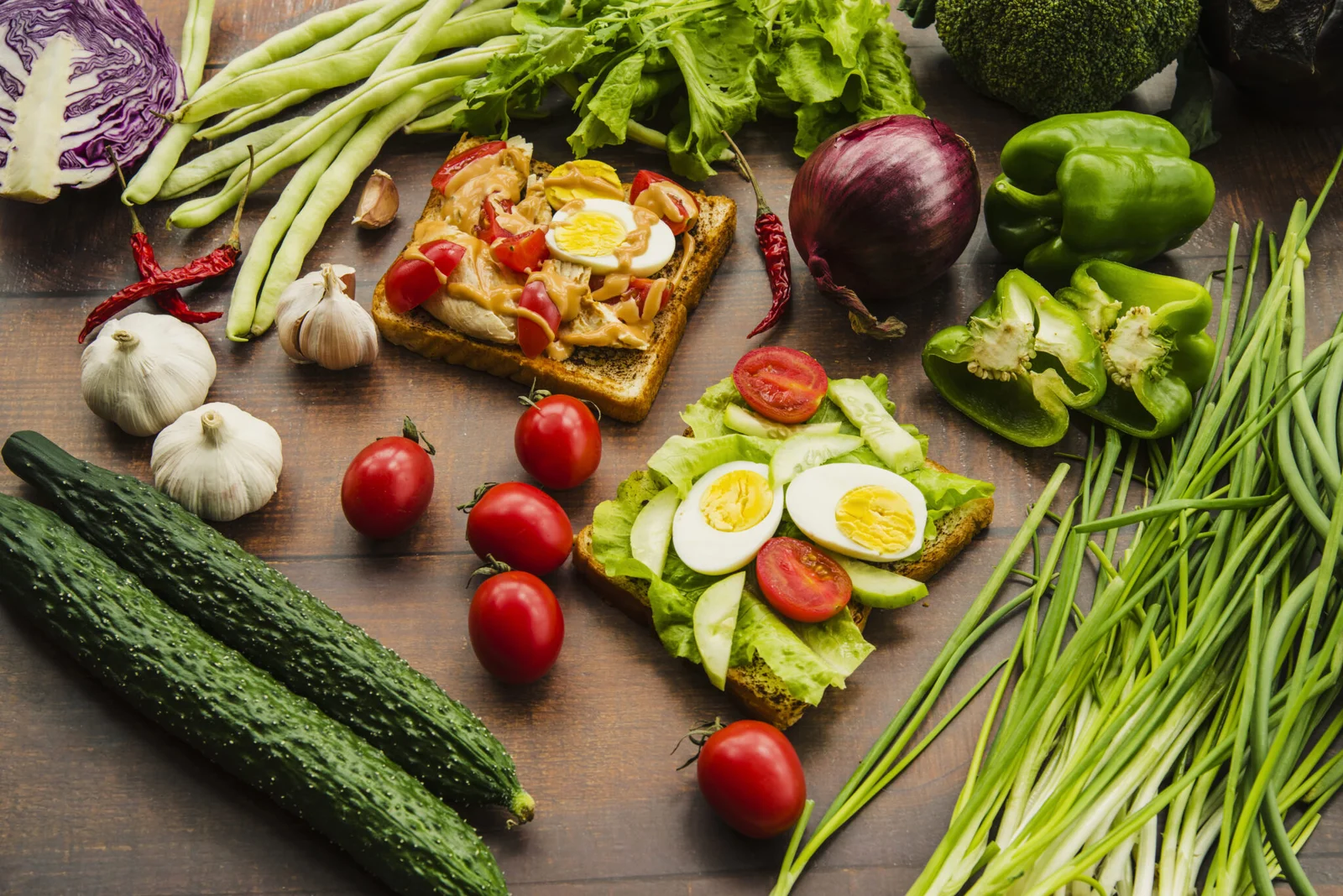 Fresh vegetables, eggs, and herbs displayed on a table, showcasing the best ingredients for healthy meal plans in Dubai.